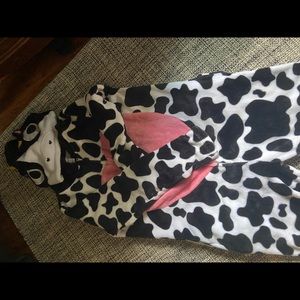 A cow onesie costume